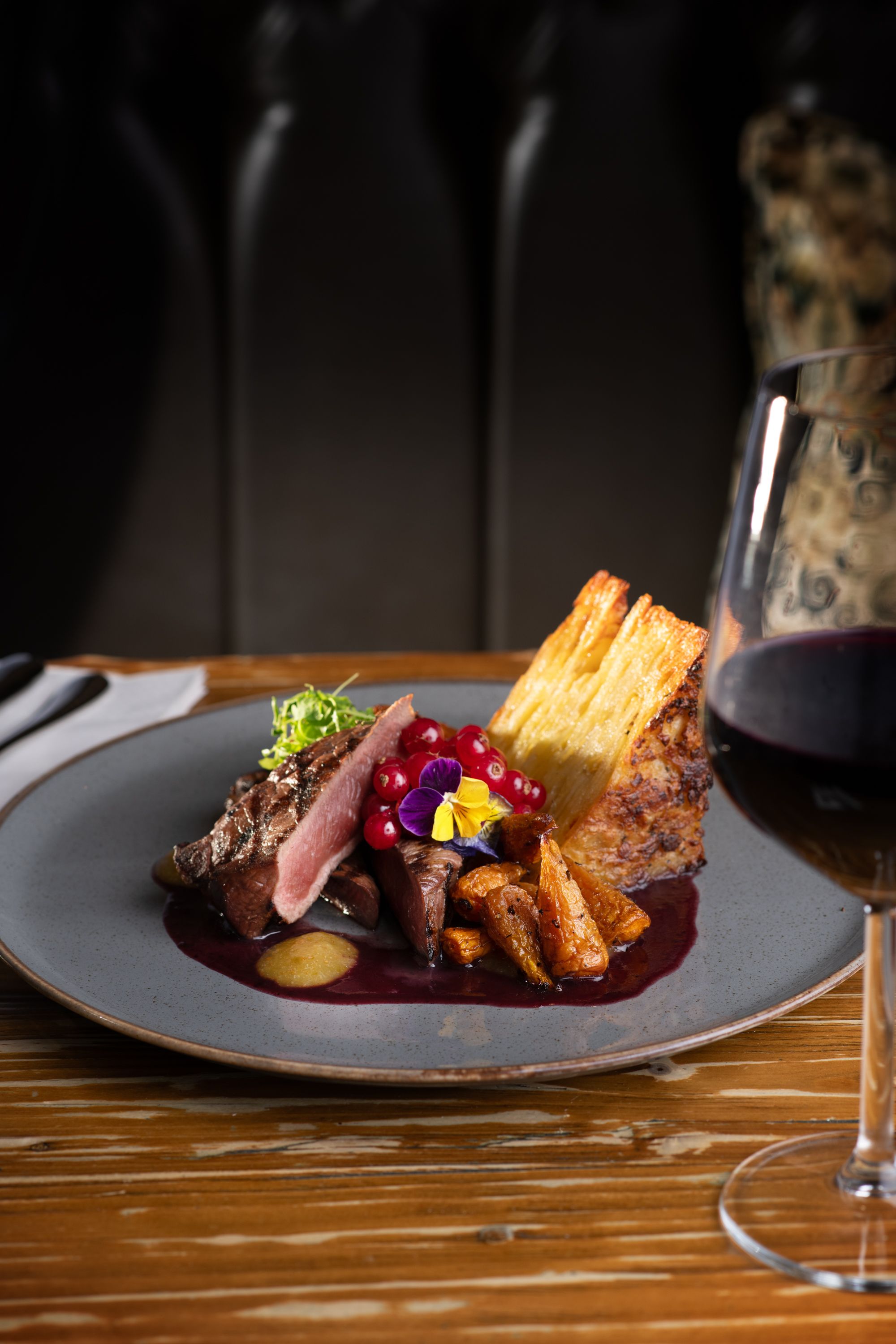 beef dish in the restaurant with wine